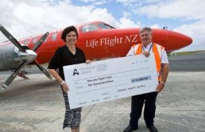 Auckland Airport's Judy Nicholl hands over the $10,000 donation to Ian Lauder from Life Flight.